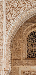 FX‑184 Arabesque Filigree Marble flexible marble panel showcasing a symmetrical Moorish arch motif filled with intricate, lace‑like arabesque carving in warm sandstone‑beige hues, by Dunya Home Design.
